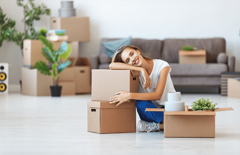 lady packing moving boxes